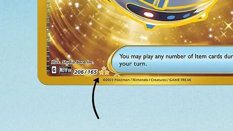 Close-up of the rarity symbol and set number on a Pokémon card